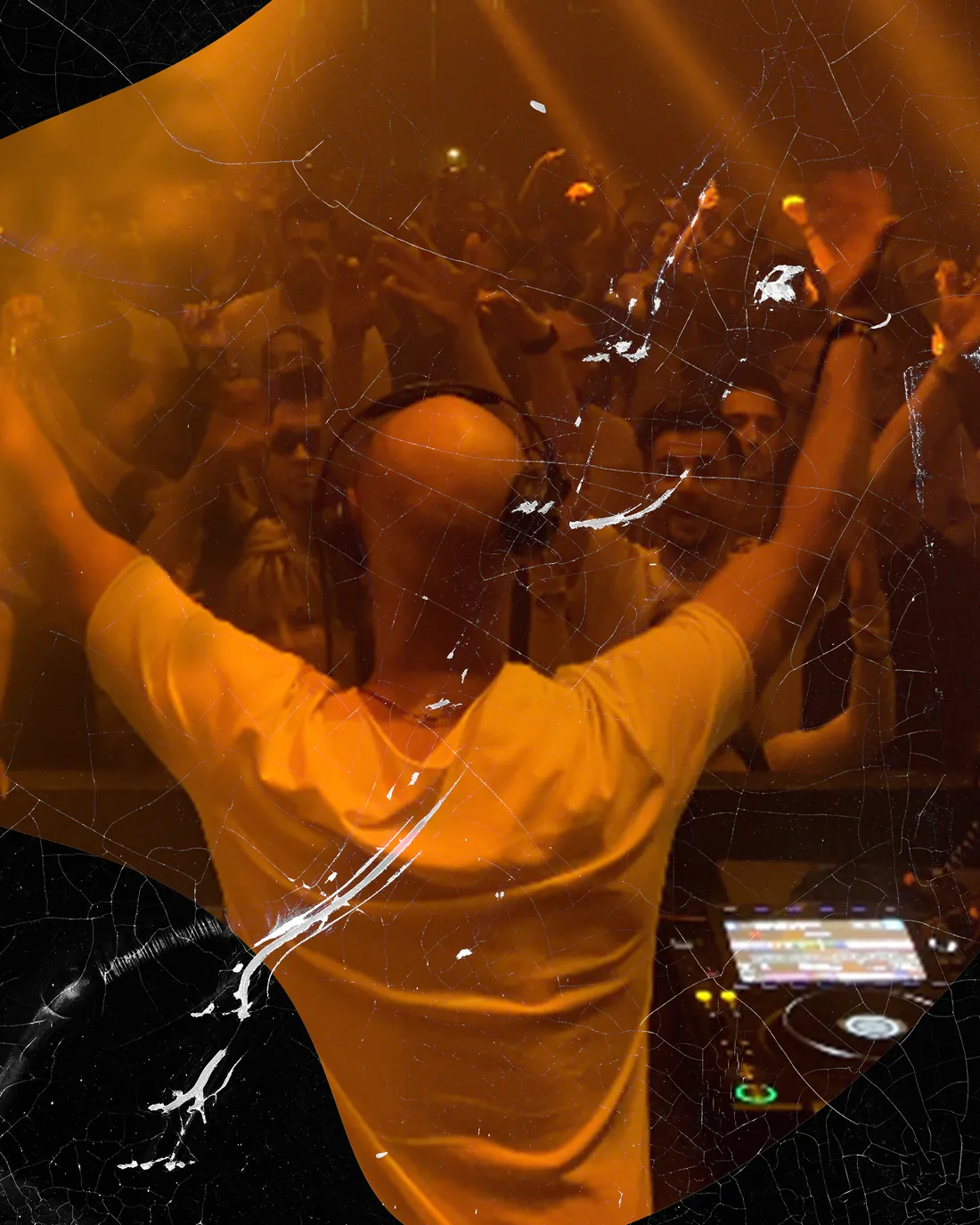 Bultech with his arms raised to a crowd in orange light